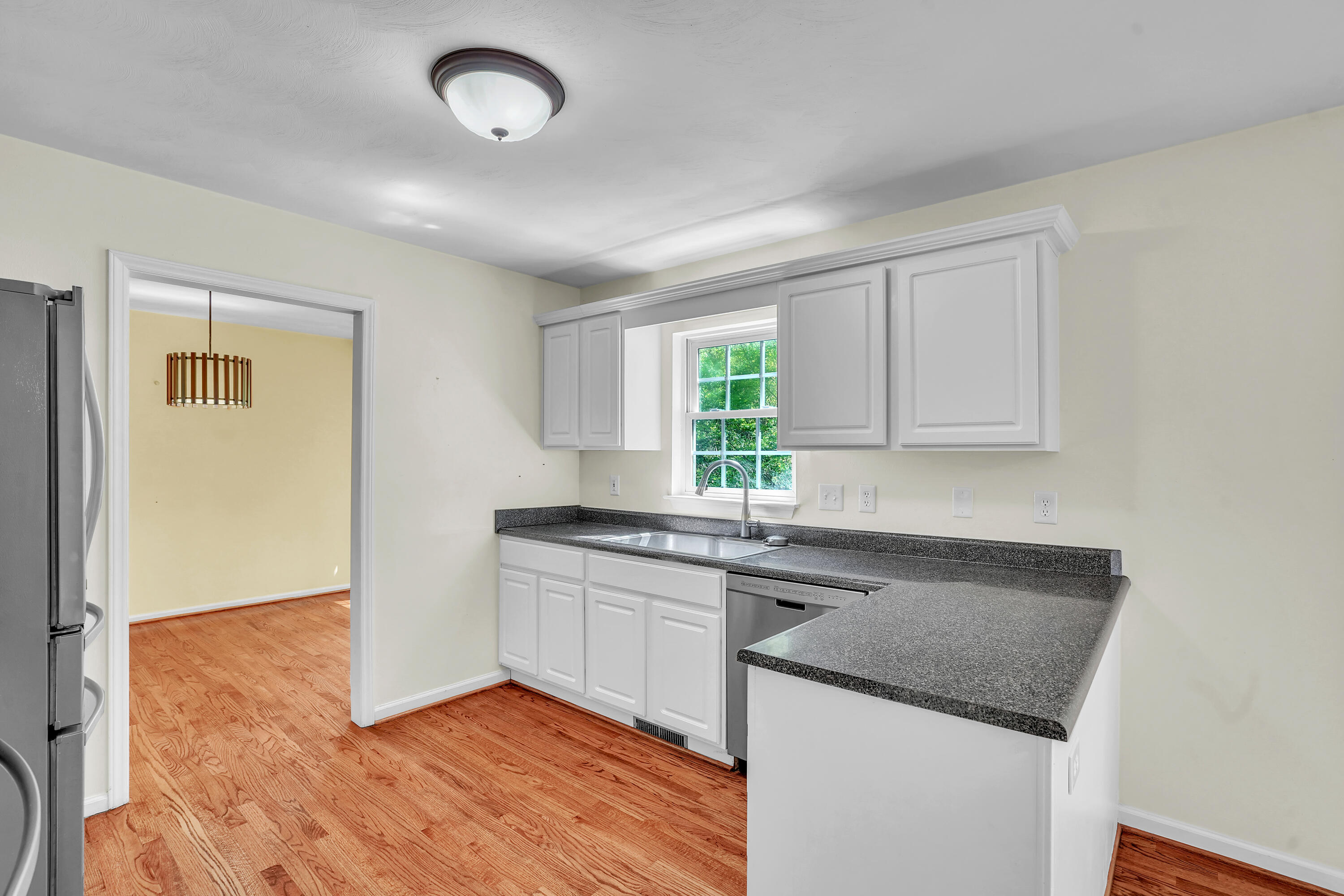 7607 Peebles Lane Roanoke, VA 24018 - Photo 14 of 57 a kitchen with granite countertop a sink and cabinets