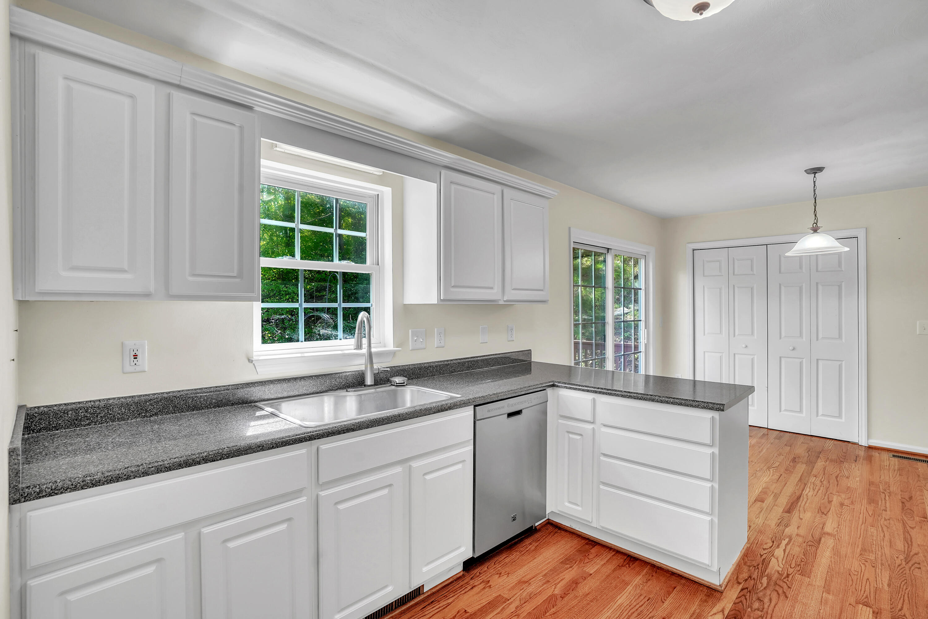 7607 Peebles Lane Roanoke, VA 24018 - Photo 16 of 57 a kitchen with granite countertop white cabinets and a sink