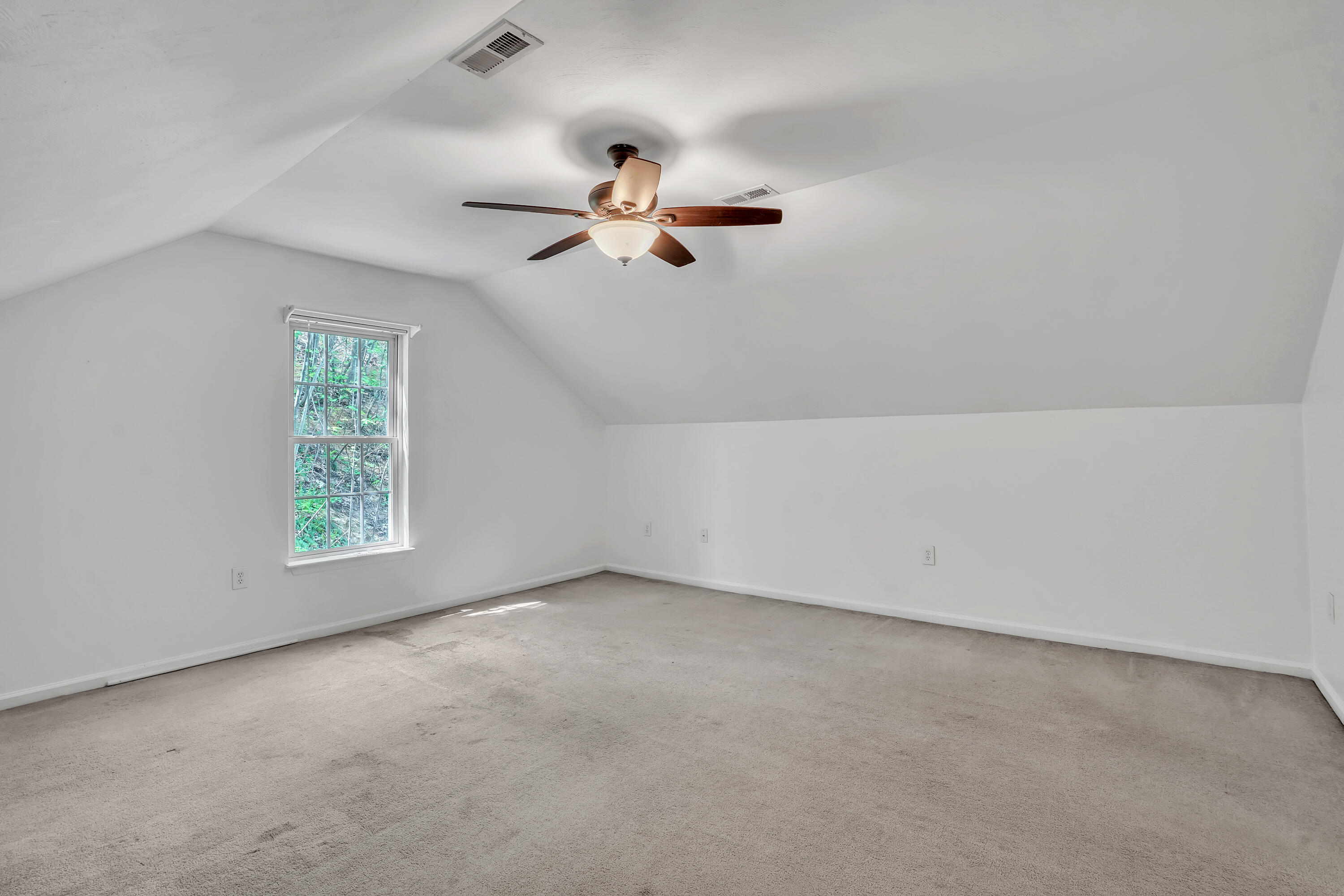7607 Peebles Lane Roanoke, VA 24018 - Photo 23 of 57 an empty room with windows and fan