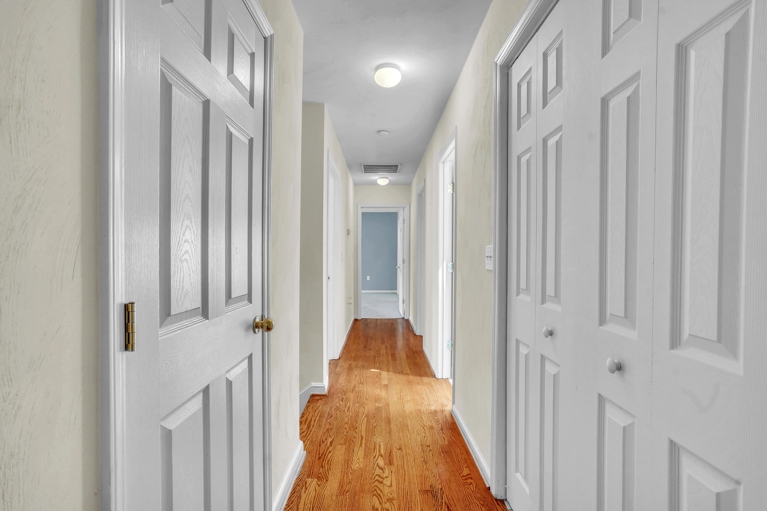 7607 Peebles Lane Roanoke, VA 24018 - Photo 26 of 57 a view of a hallway with wooden floor and staircase