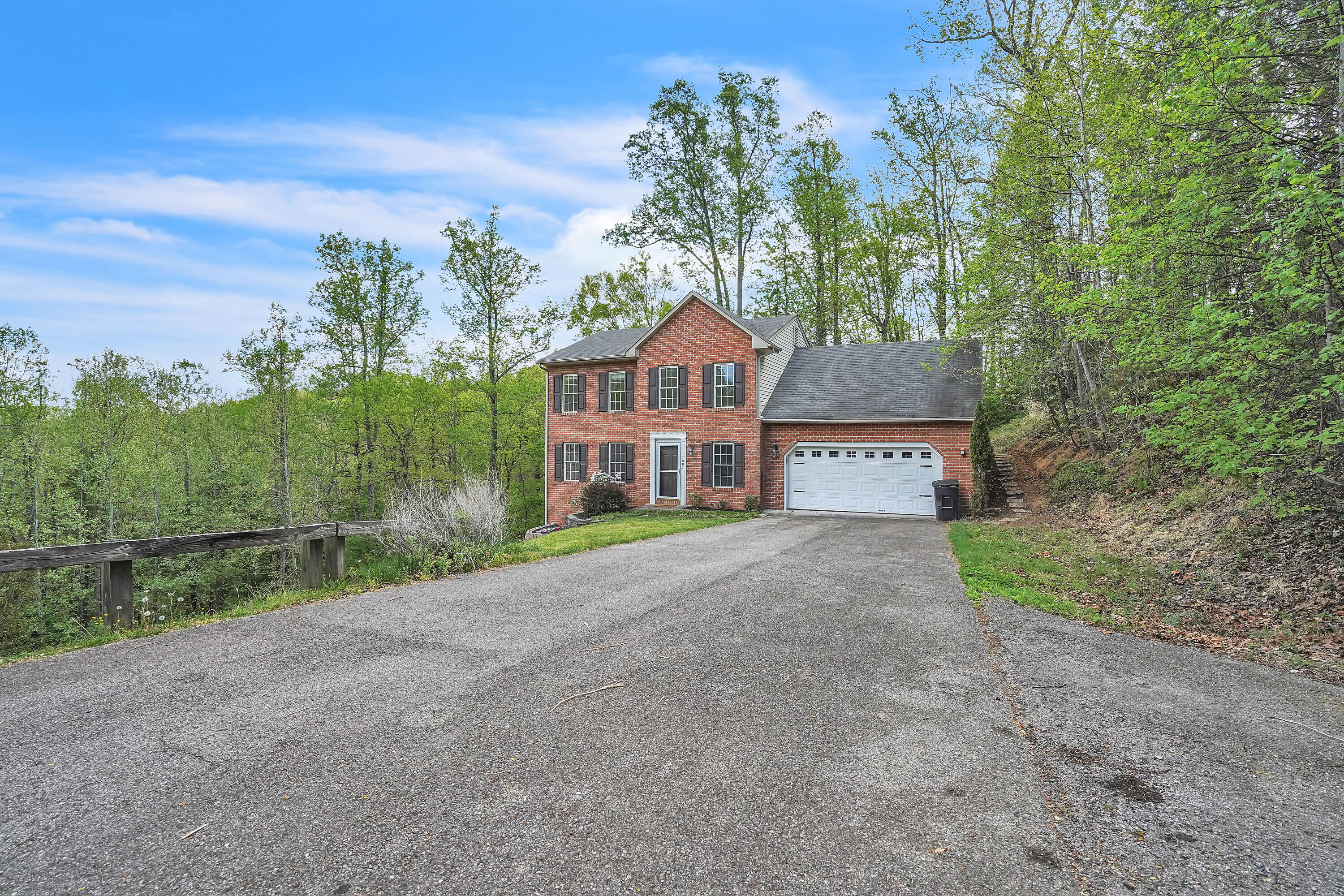 7607 Peebles Lane Roanoke, VA 24018 - Photo 3 of 57 a view of a big house with a big yard and large tree