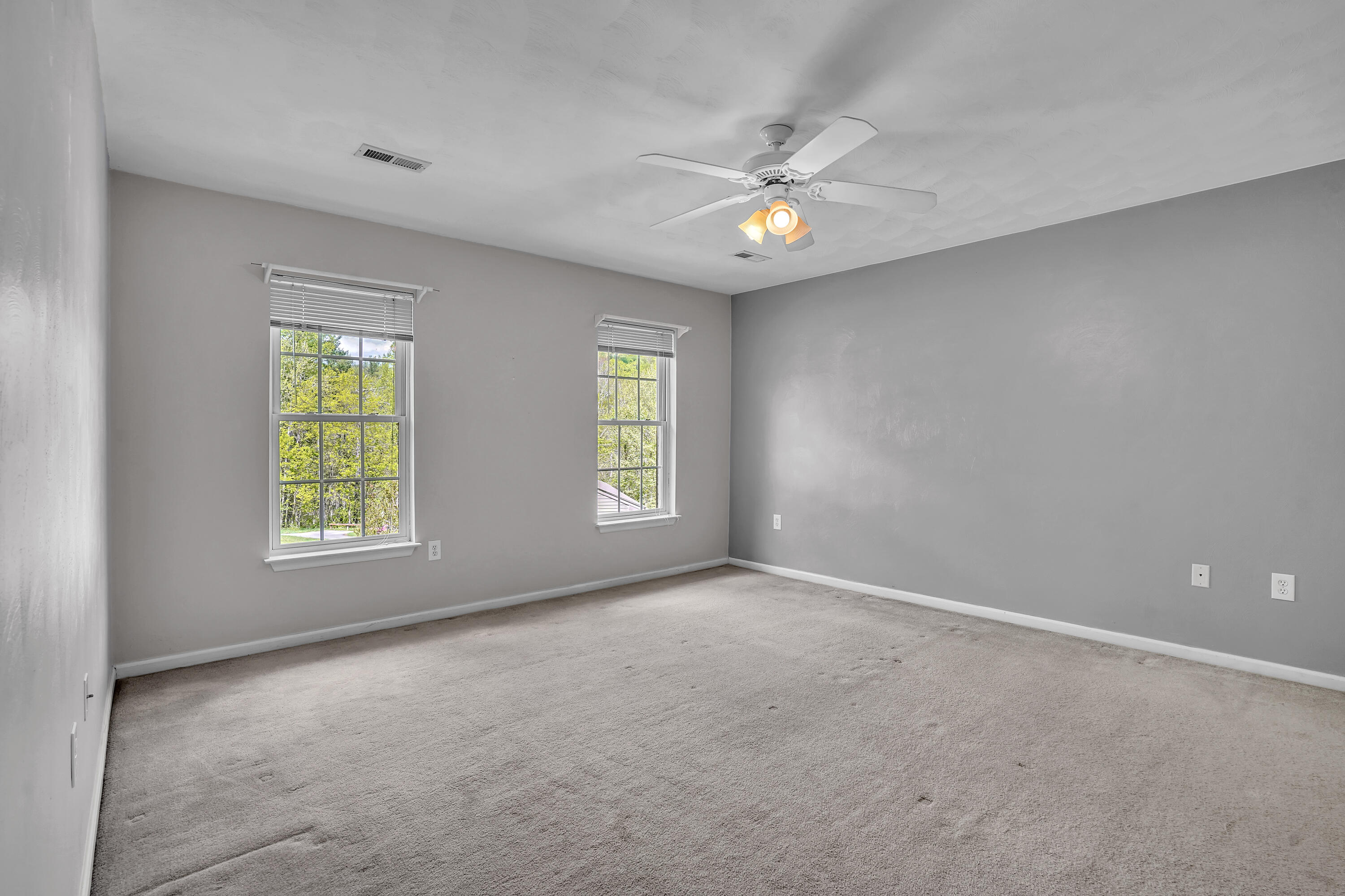 7607 Peebles Lane Roanoke, VA 24018 - Photo 31 of 57 a view of an empty room with window and chandelier fan