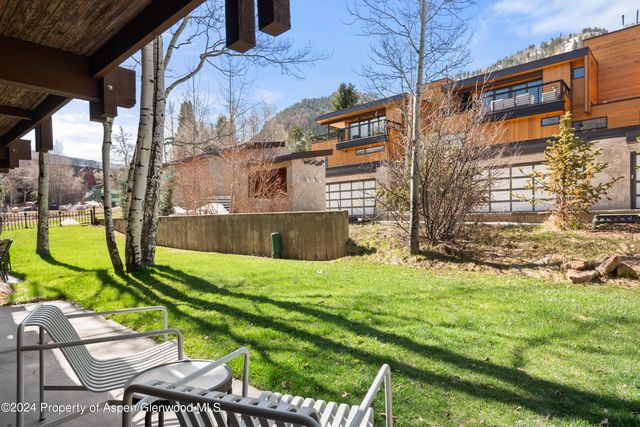a view of backyard with swimming pool