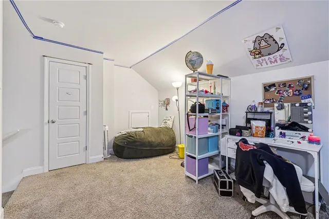 a bed room with a bed and a gym machine