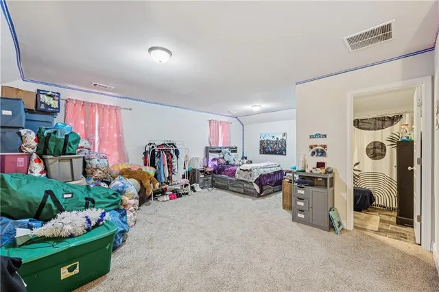 a bathroom with a sink vanity granite and a mirror