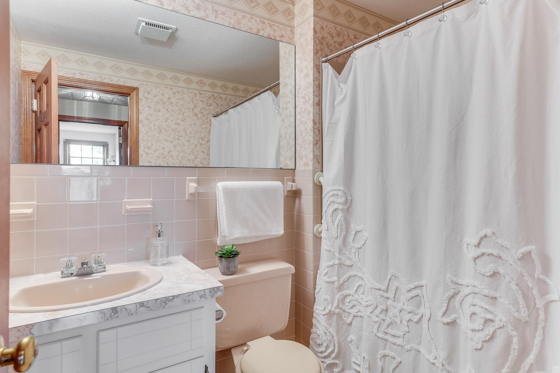 17 Eben Smith Road Centerville, MA 02632 - Photo 27 of 30 a bathroom with a sink a toilet and a mirror