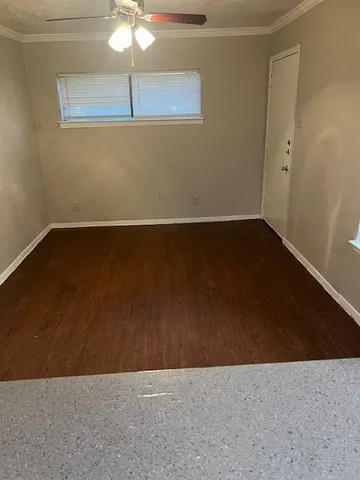 an empty room with a fan