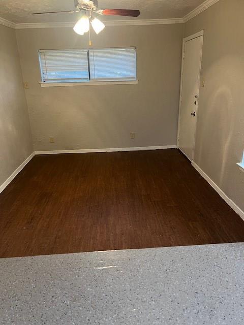 4040 Brown Street, Unit 9 Dallas, TX 75219 - Photo 4 of 11 an empty room with a fan