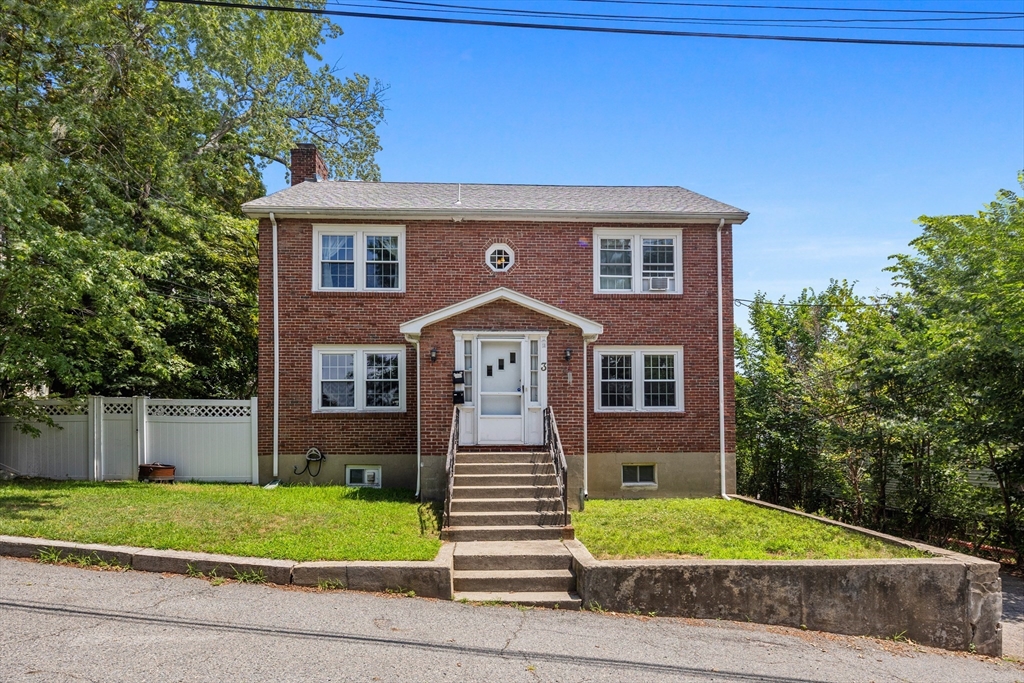 3 Allen Road Boston, MA 02135 - Photo 1 of 1 a front view of a house with a yard and garage