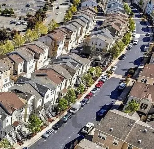 an aerial view of a city with lots of residential buildings