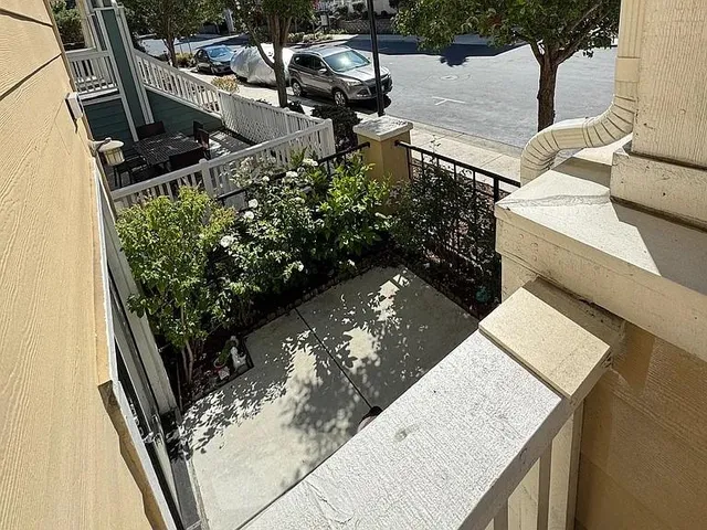 a pathway of a house with a yard