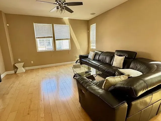 a living room with furniture and a window