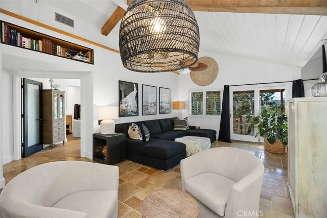 a kitchen with a table chairs sink and cabinets