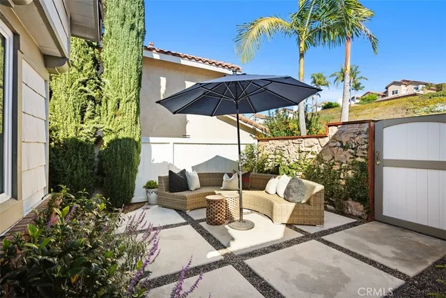 a view of living room with furniture and a potted plant
