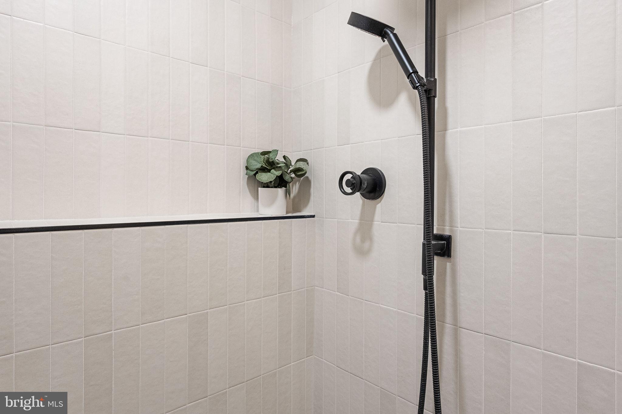 3287 Sutton Place Northwest, Unit D Washington, DC 20016 - Photo 31 of 52 Beautiful wall tile and glass shower enclosure