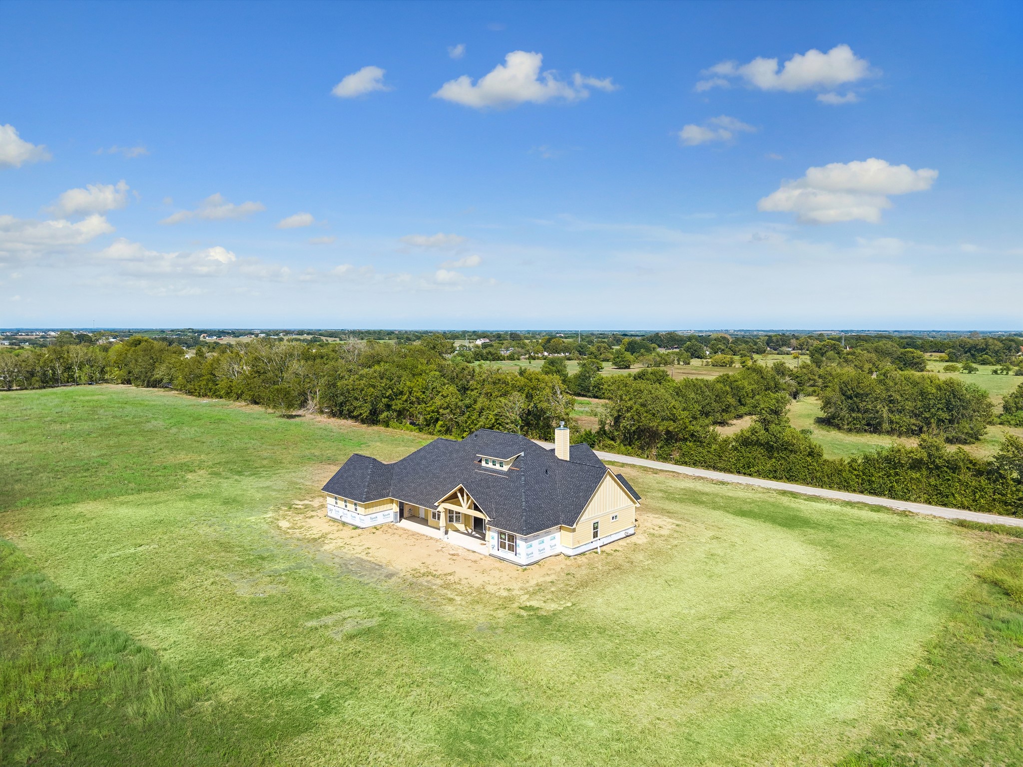 6750 Schroeder Road Brenham, TX 77833 - Photo 10 of 10 Charming countryside retreat nestled on expansive, lush acreage, offering privacy and serene views.