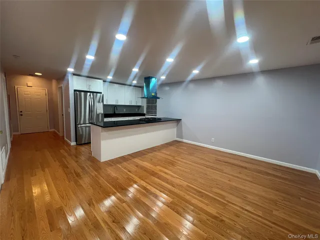 a view of a kitchen with a sink and an oven