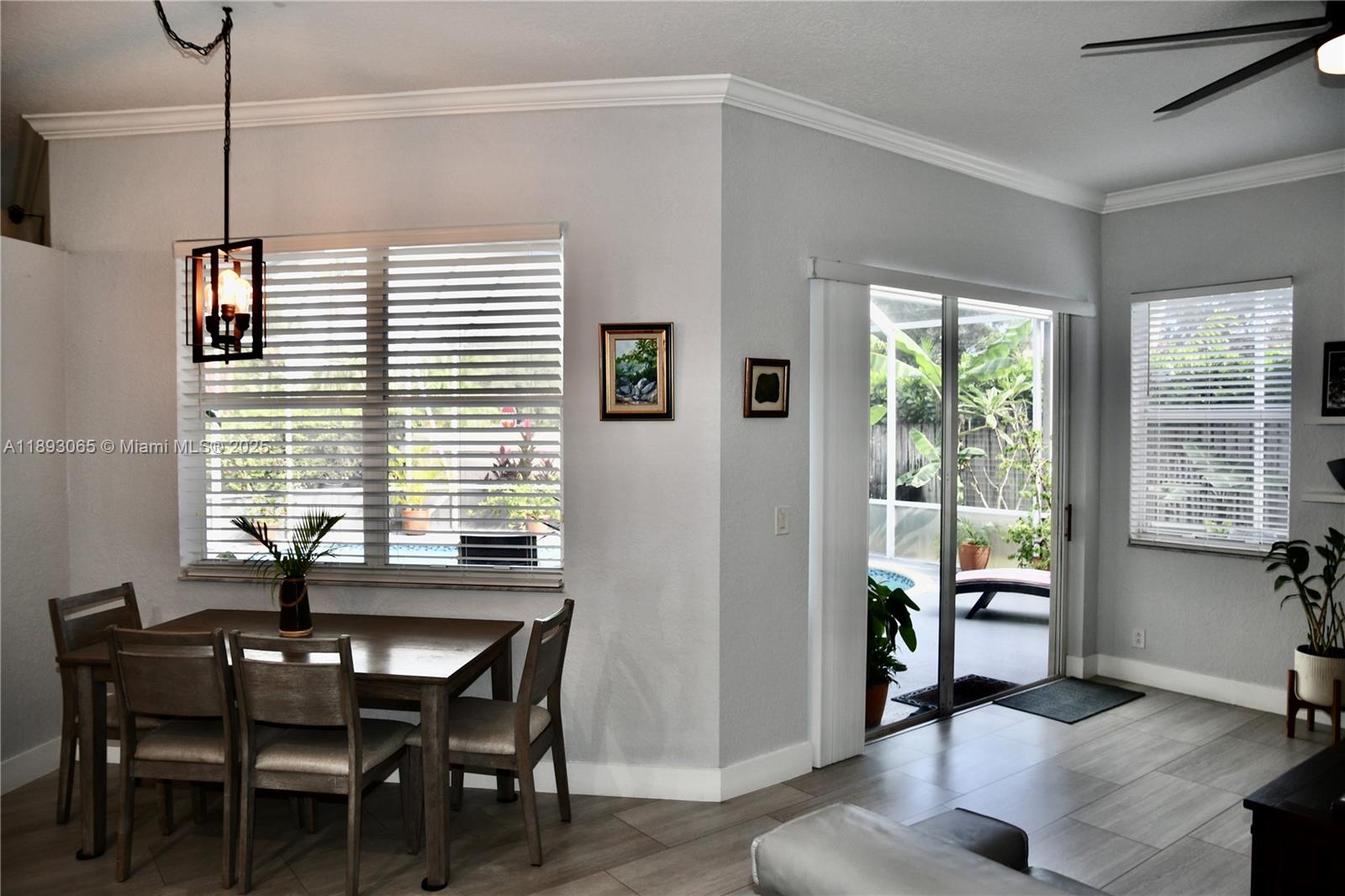 1335 East Barwick Ranch Circle Delray Beach, FL 33445 - Photo 13 of 33 a view of a dining room with furniture window and outside view