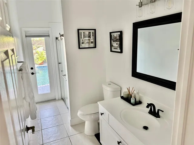 a bathroom with a toilet sink and shower