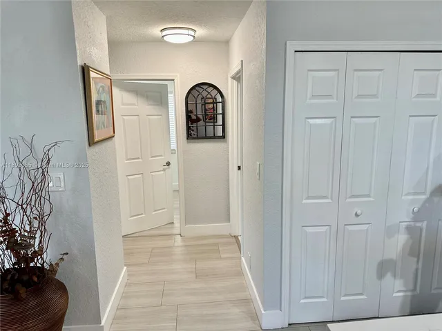 a view of a door with a potted plant