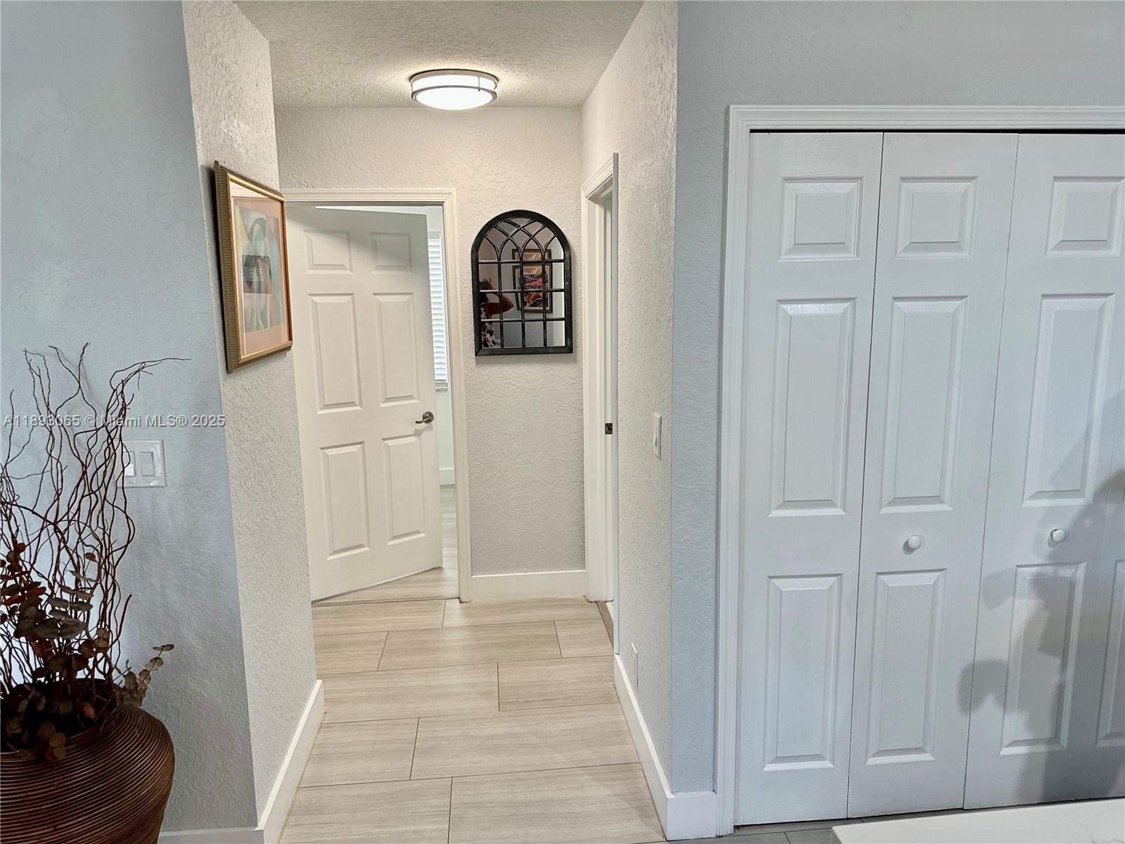 1335 East Barwick Ranch Circle Delray Beach, FL 33445 - Photo 24 of 33 a view of a door with a potted plant