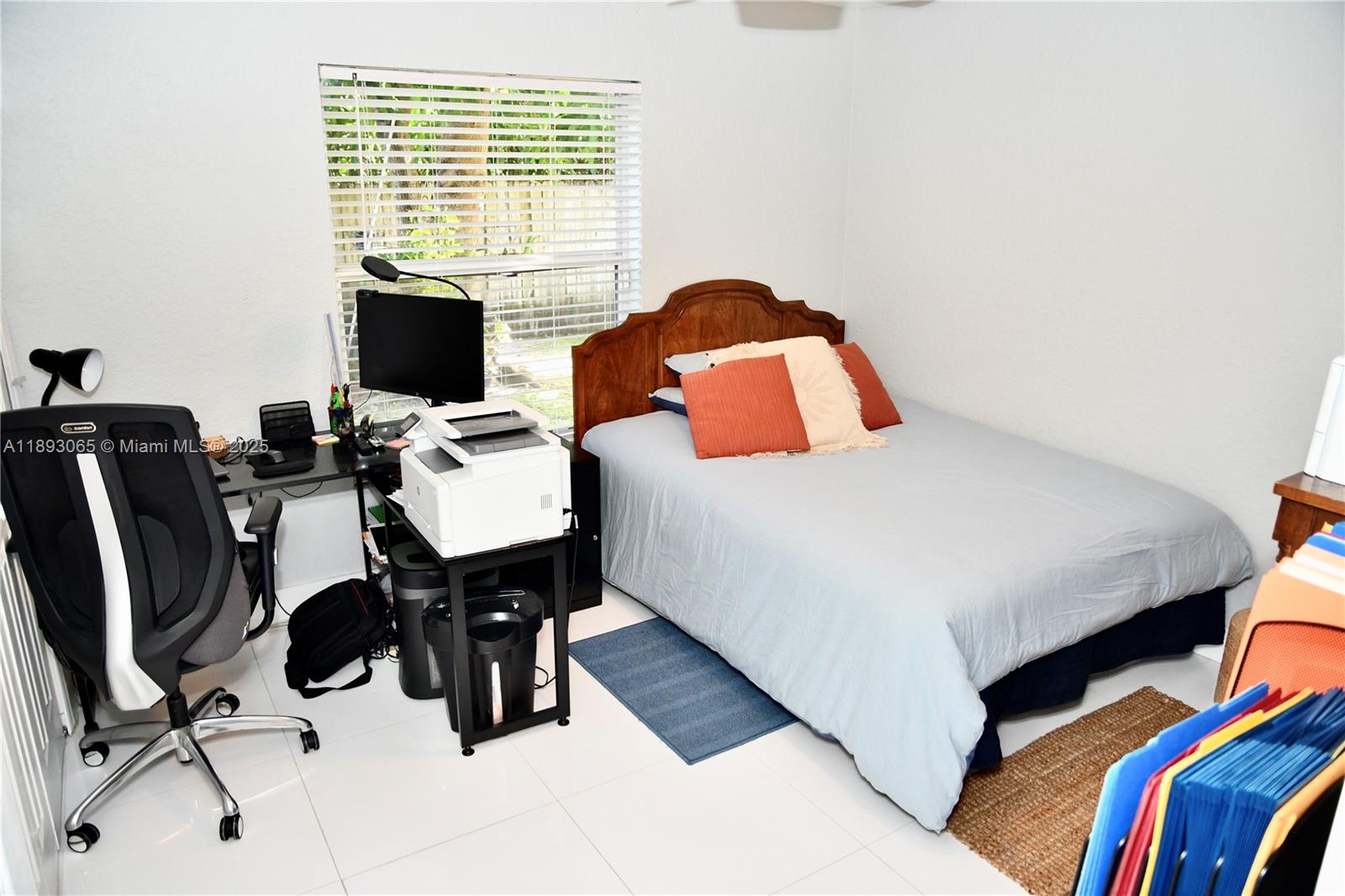 1335 East Barwick Ranch Circle Delray Beach, FL 33445 - Photo 27 of 33 a bedroom with a bed and a computer on a desk