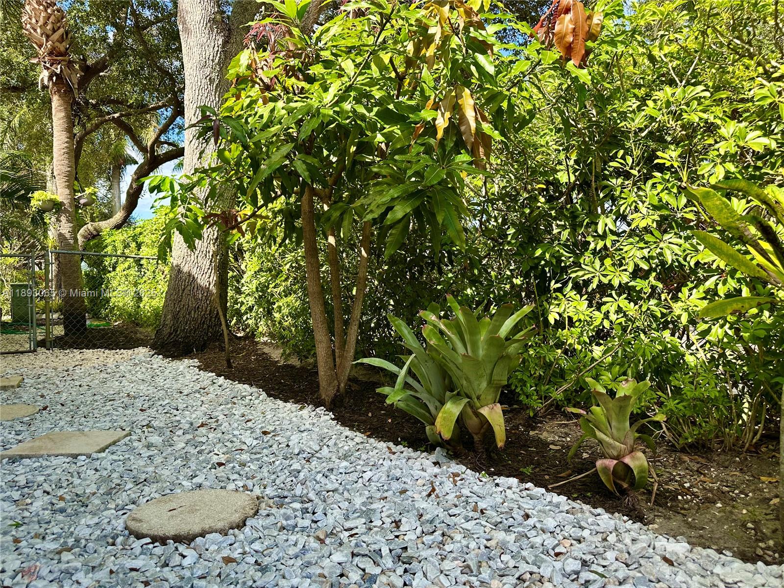 1335 East Barwick Ranch Circle Delray Beach, FL 33445 - Photo 31 of 33 a view of a backyard of a house