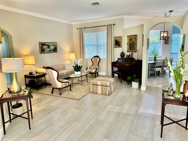 a living room with furniture and a window