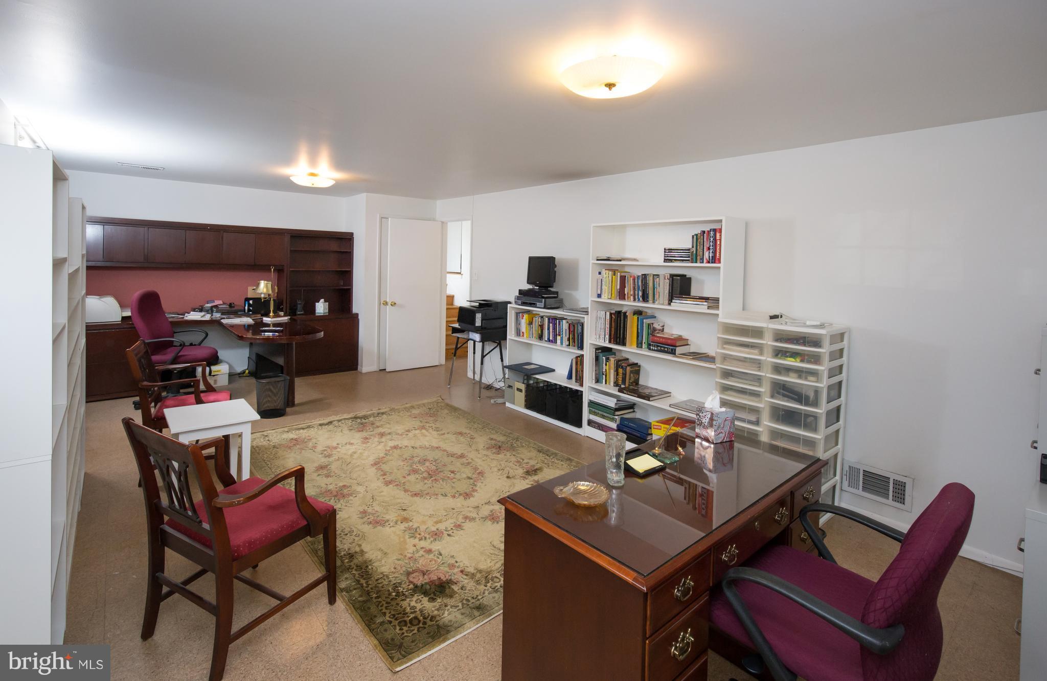 5227 Milland Street Springfield, VA 22151 - Photo 21 of 28 a living room with furniture and a flat screen tv
