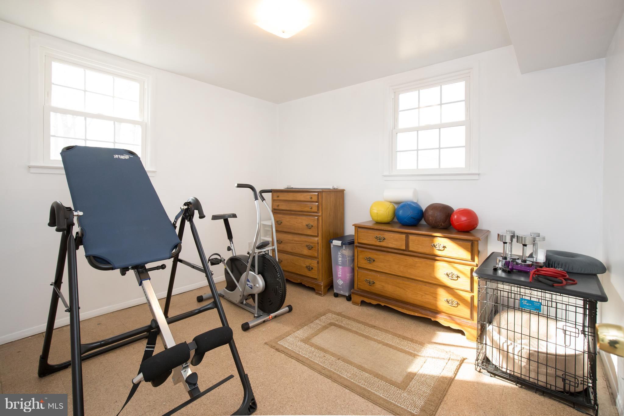 5227 Milland Street Springfield, VA 22151 - Photo 23 of 28 a bed room with a bed and a window