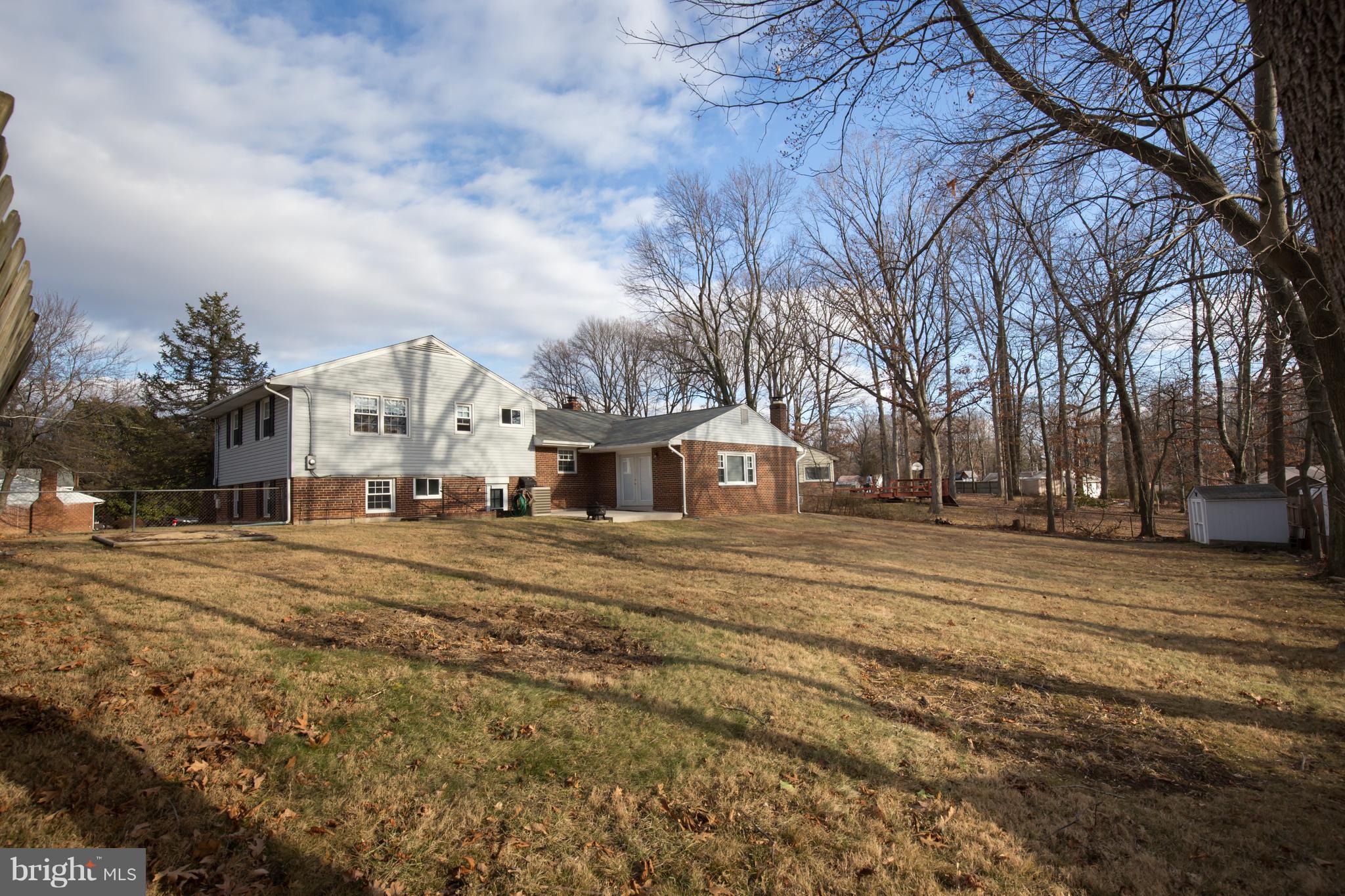 5227 Milland Street Springfield, VA 22151 - Photo 27 of 28 a view of road with large trees