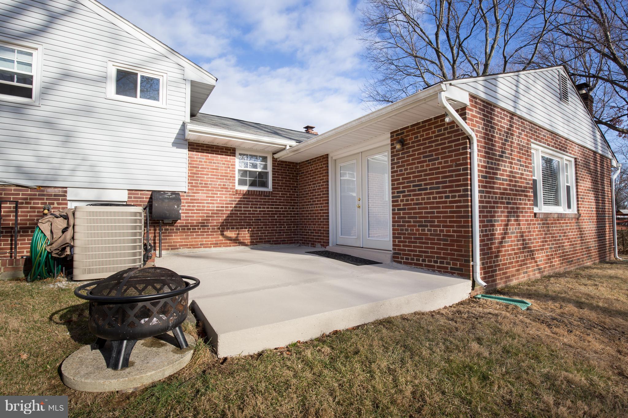 5227 Milland Street Springfield, VA 22151 - Photo 28 of 28 a backyard of a house with table and chairs