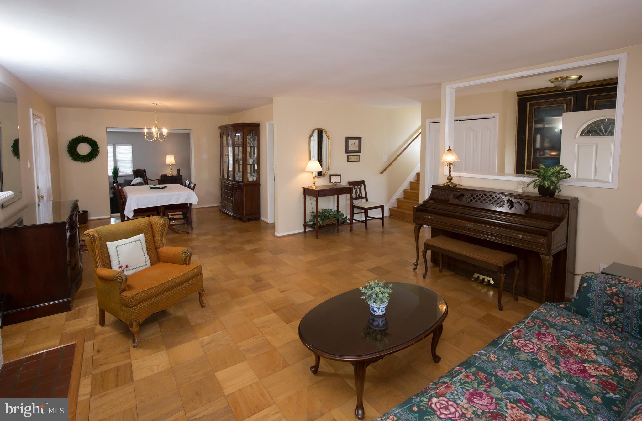 5227 Milland Street Springfield, VA 22151 - Photo 5 of 28 a living room with furniture and a piano