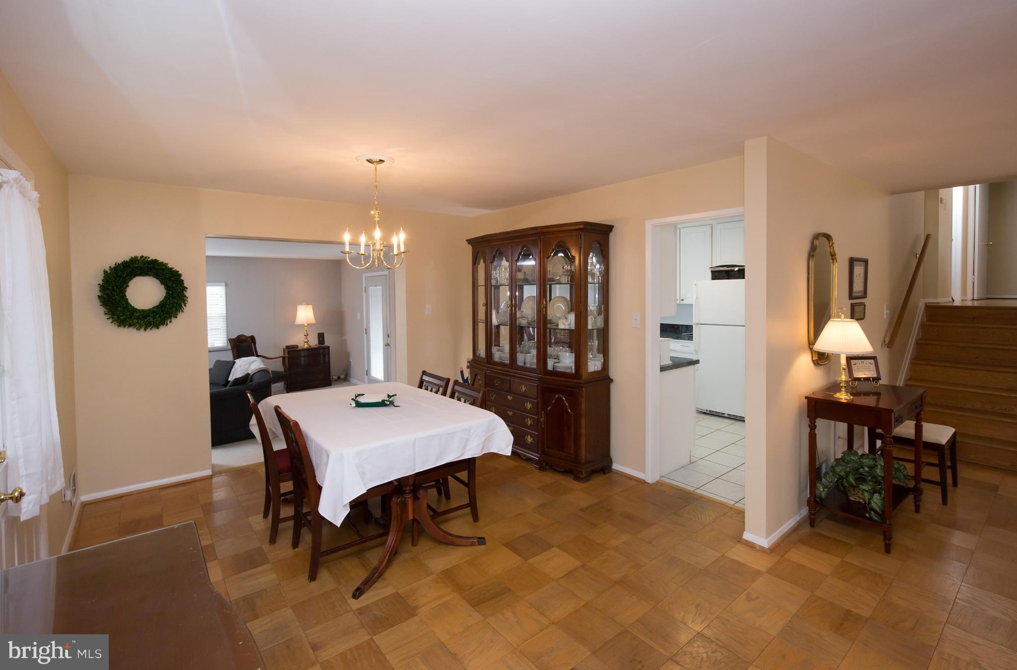 5227 Milland Street Springfield, VA 22151 - Photo 6 of 28 a room with table chairs and a refrigerator