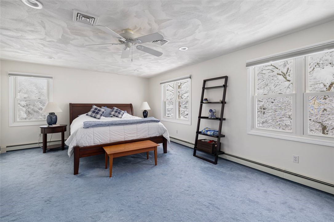 117 Moccasin Trail Cranston, RI 02921 - Photo 17 of 43 Primary Bedroom - Southern facing Primary suite is spacious with plenty of space for your furniture. Room dimension 21 X 14.3