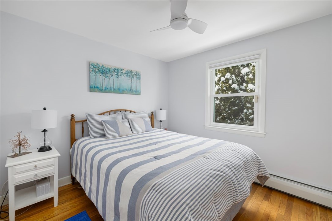 117 Moccasin Trail Cranston, RI 02921 - Photo 18 of 43 Bedroom - First floor bedroom with hardwood floors, ceiling fan. Room dimensions 9.7 X 10.6