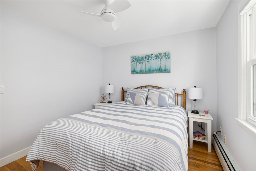 117 Moccasin Trail Cranston, RI 02921 - Photo 19 of 43 Bedroom - First floor bedroom with hardwood floors, ceiling fan. Room dimensions 9.7 X 10.6