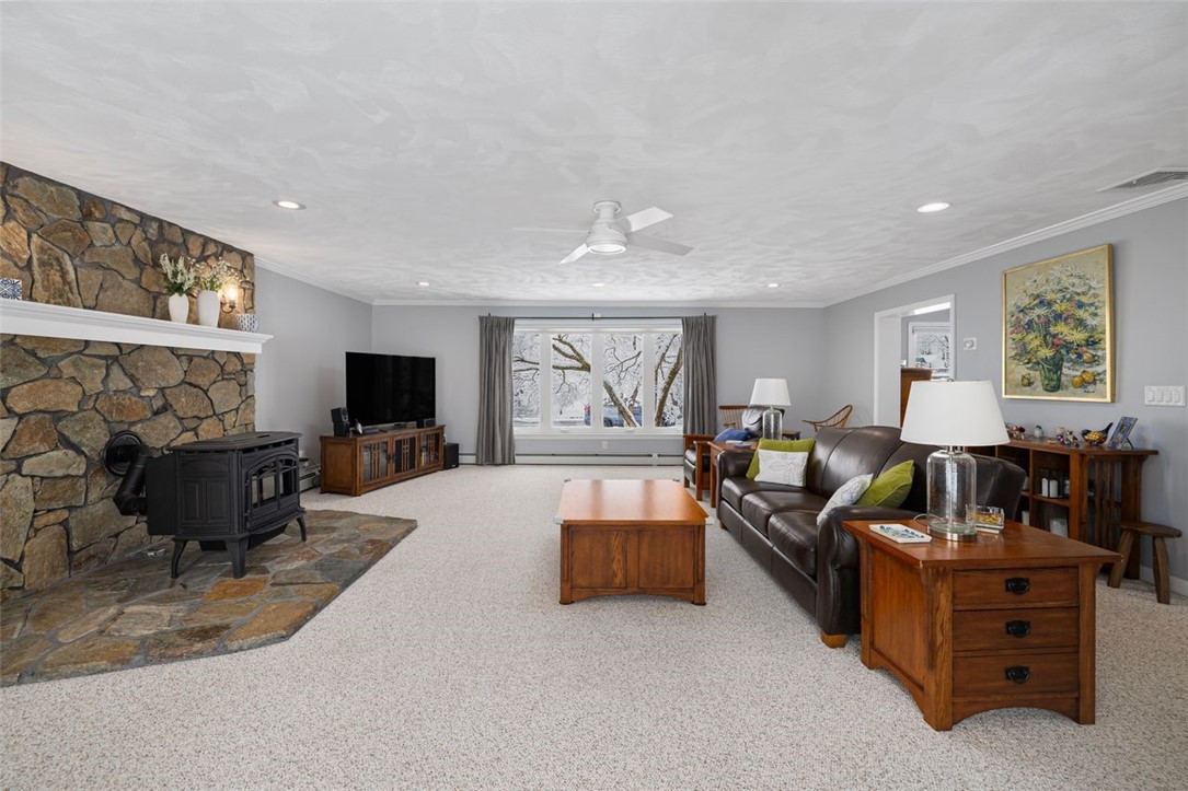 117 Moccasin Trail Cranston, RI 02921 - Photo 2 of 43 Living Room - Spacious layout with recessed lights, ceiling fan, natural light, crown molding and plenty of room for your furniture in this combination family/ living room.