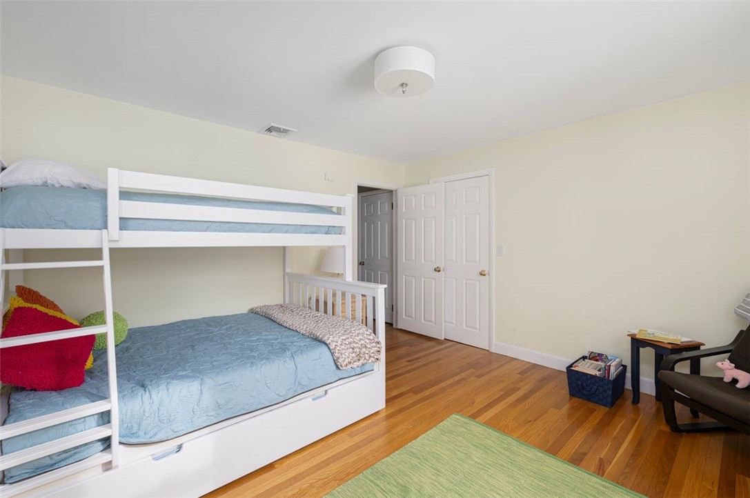 117 Moccasin Trail Cranston, RI 02921 - Photo 22 of 43 Bedroom - Bright and sunny first bedroom southern and western facing with hardwood floors. Room dimensions 13.5 X 12.5