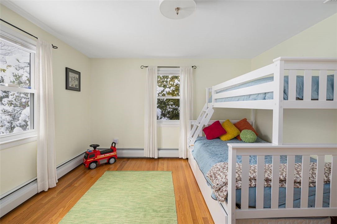 117 Moccasin Trail Cranston, RI 02921 - Photo 23 of 43 Bedroom - Bright and sunny first bedroom southern and western facing with hardwood floors. Room dimensions 13.5 X 12.5