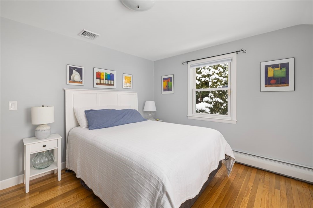 117 Moccasin Trail Cranston, RI 02921 - Photo 24 of 43 Bedroom - First floor bedroom, hardwood floors refinished September 2025. Room dimensions 13.1 X 10.8