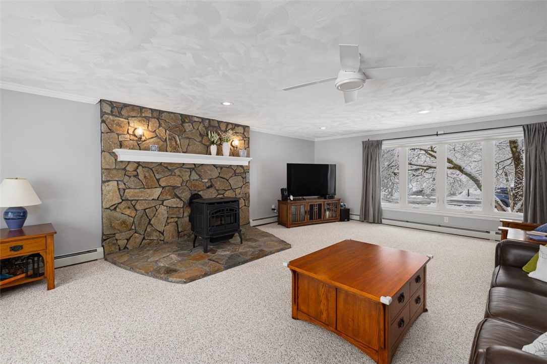 117 Moccasin Trail Cranston, RI 02921 - Photo 3 of 43 Living Room - Spacious layout with recessed lights, ceiling fan, natural light, crown molding and plenty of room for your furniture in this combination family/ living room.