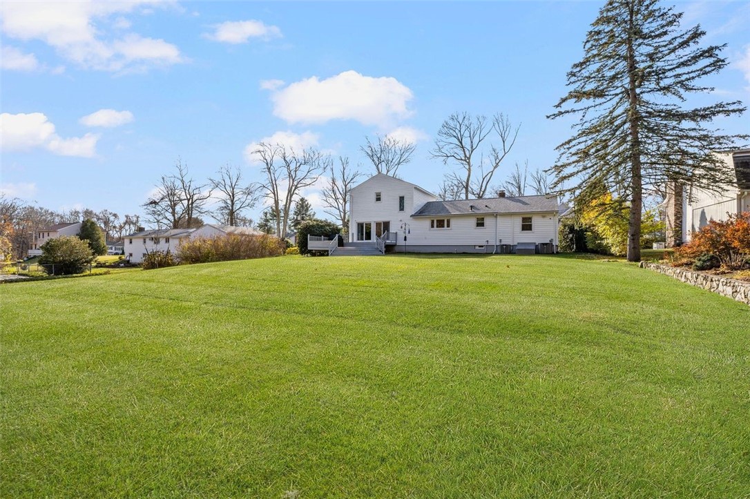 117 Moccasin Trail Cranston, RI 02921 - Photo 38 of 43 Back of Structure - Meticulous landscaped back yard.