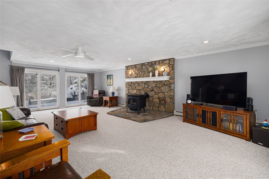 117 Moccasin Trail Cranston, RI 02921 - Photo 5 of 43 Living Room - Spacious layout with recessed lights, ceiling fan, natural light, crown molding and plenty of room for your furniture in this combination family/ living room.
