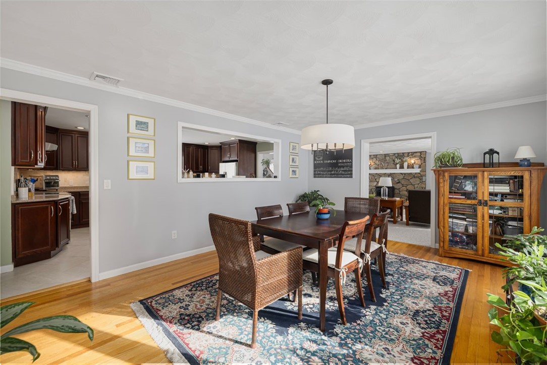 117 Moccasin Trail Cranston, RI 02921 - Photo 6 of 43 Dining Room - The dining room features natural light, beautiful hardwood flooring and access to the kitchen and living room.