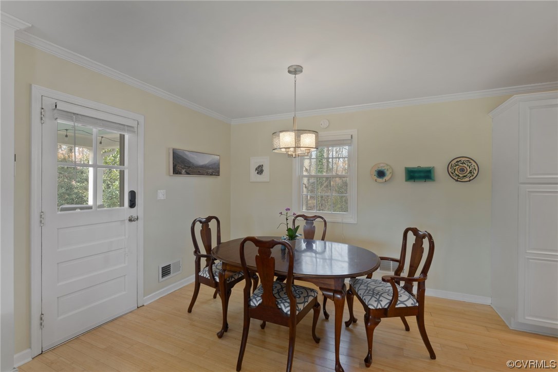 111 Elkhorn Road Charlottesville, VA 22903 - Photo 8 of 50 a view of a dining room with furniture window and wooden floor