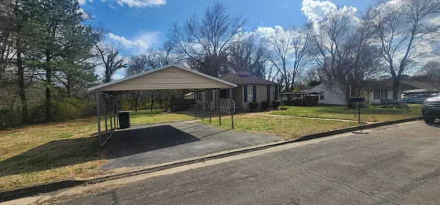 a house with trees in the background