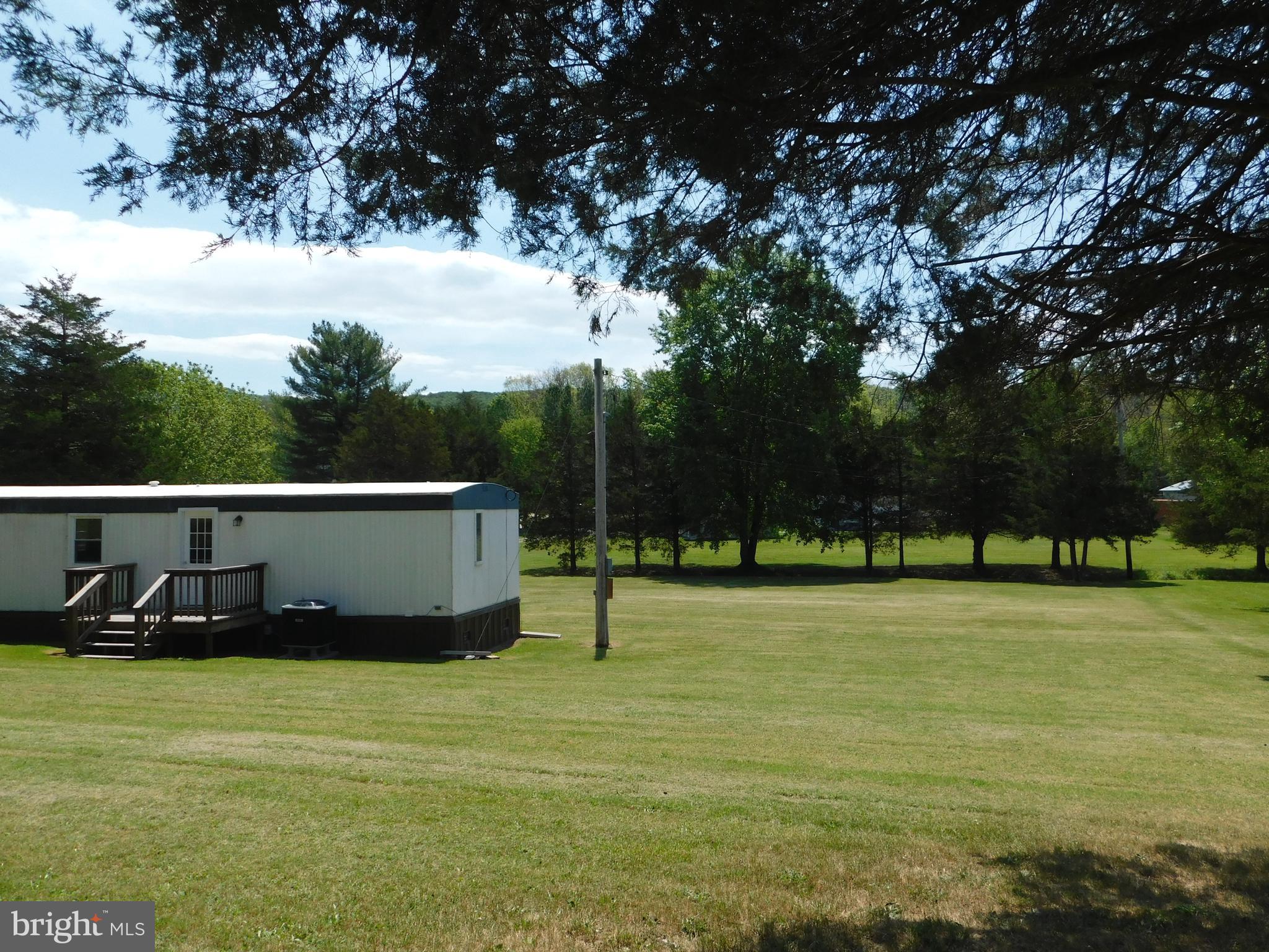192 AA Rogers Road Augusta, WV 26704 - Photo 30 of 34 a view of a swimming pool with a yard and trees