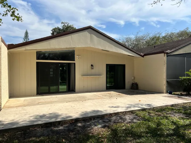 a house with trees in the background