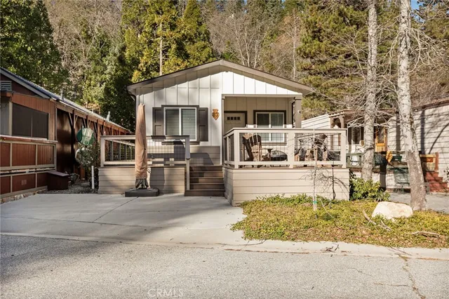 a front view of a house with basket ball court and outdoor seating